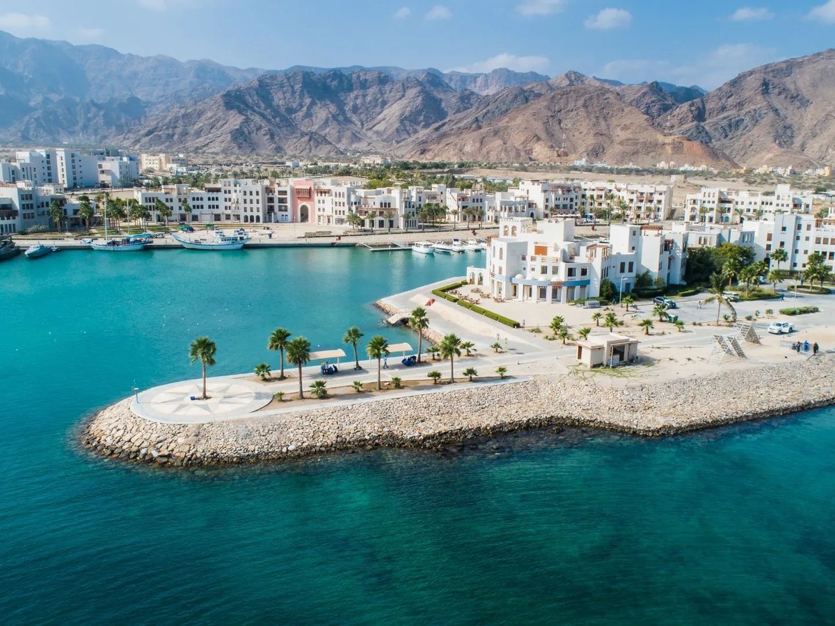 Aerial view of the Jebel Sifah marina and the Al Hajar Mountains