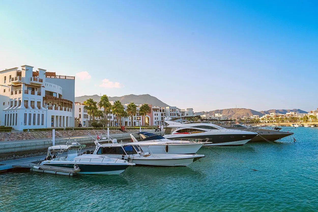 Jebel Sifah — marina with yachts and the resort buildings