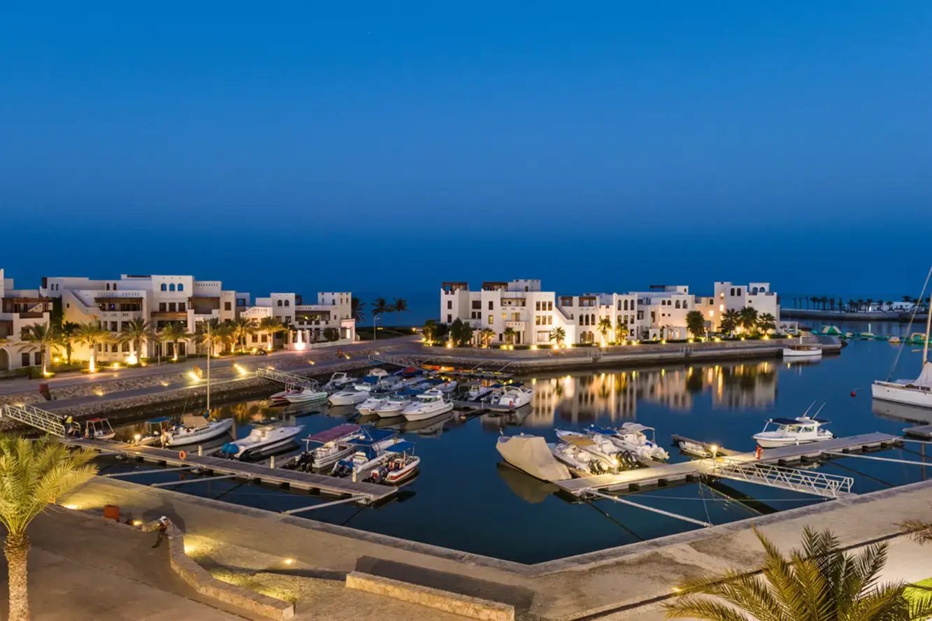 Jebel Sifah — marina with lights in the evening